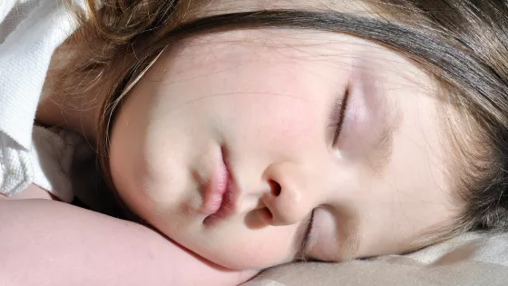 School student sleeping on her side