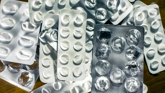 Empty pill packets represent epilepsy medication shortages.