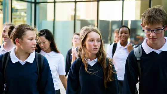 Group of young people in a corridor at secondary school