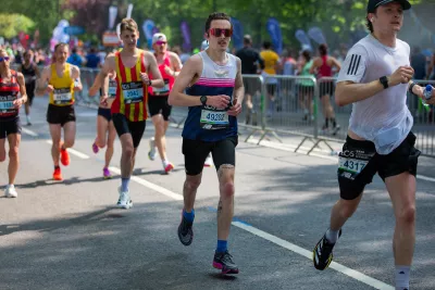 Jack runs the London Marathon wearing sunglasses.
