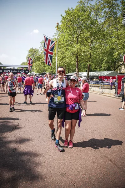 Marathon runner Jack jogs alongside London's Green Park.