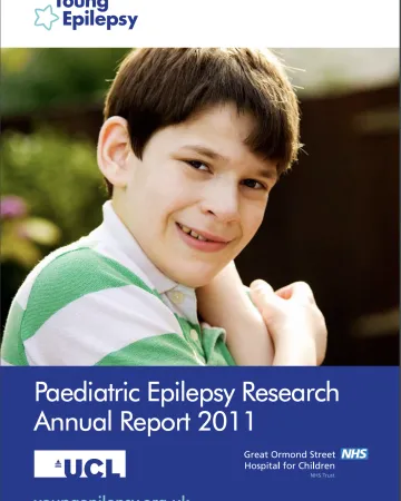 A boy smiles on the Research Report 2011 cover.