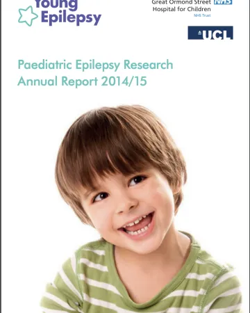 A young boy in a striped shirt grins on the Research Report 2014-15 cover.