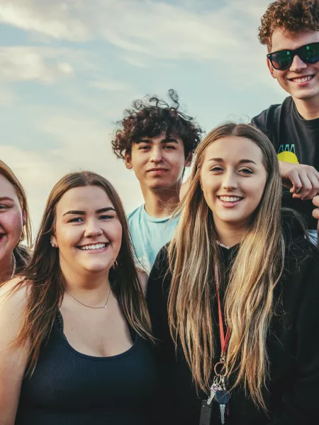 a group of young people looking at a camera