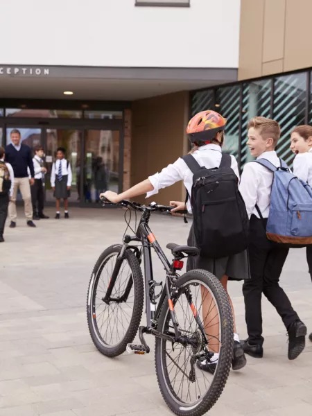kids going to school on a bike