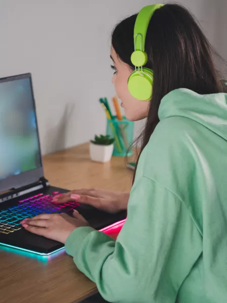 Young girl on her laptop for a Virtual Youth Club
